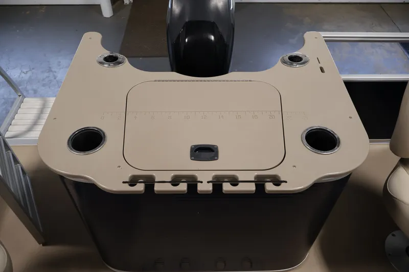 Slide: The Image of 2012 Bennington 2075 GS boat console with cup holders and storage compartment. - 40