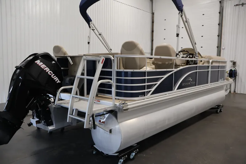 Slide: The Image of 2012 Bennington 2075 GS pontoon boat with Mercury outboard motor in a garage setting. - 5