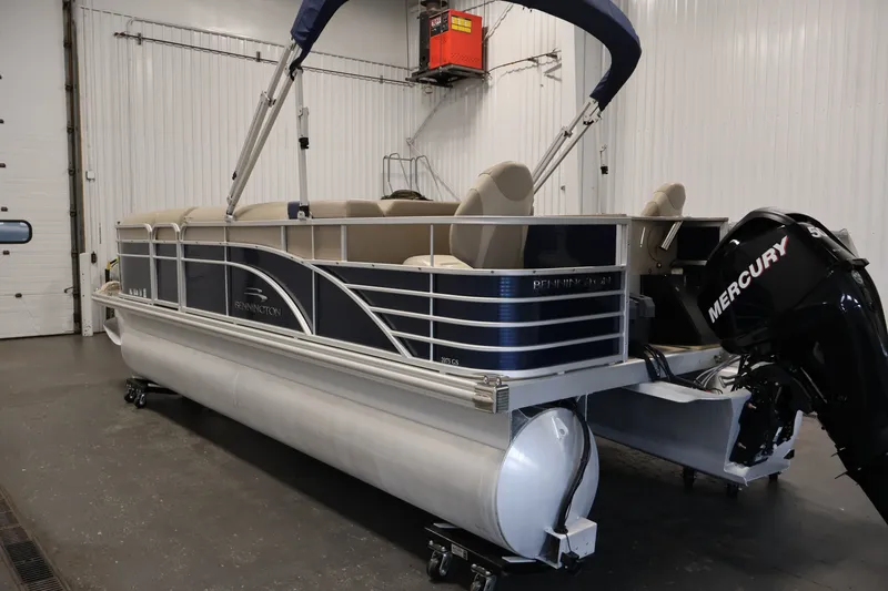 Slide: The Image of 2012 Bennington 2075 GS pontoon boat with Mercury engine in indoor storage. - 7
