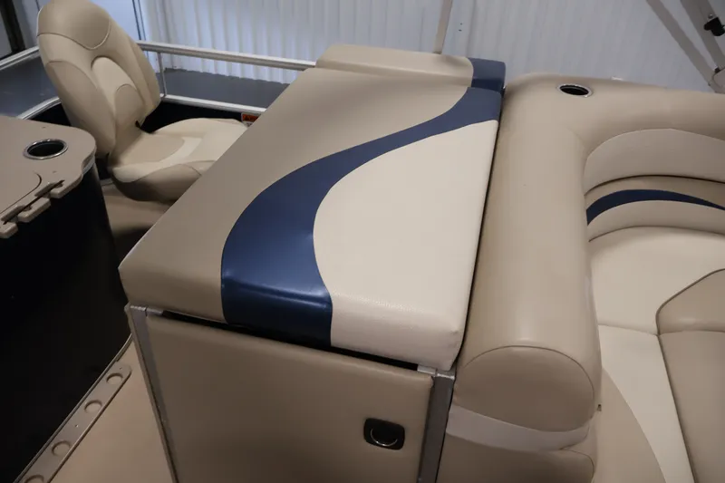 Slide: The Image of 2012 Bennington 2075 GS boat interior with beige and blue seating. - 36