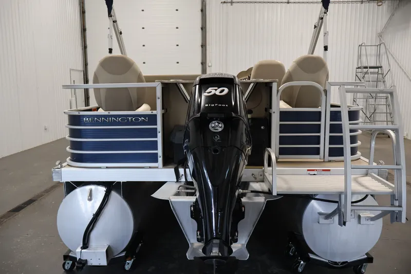 Slide: The Image of 2012 Bennington 2075 GS pontoon boat with 50 HP motor in a storage facility. - 6