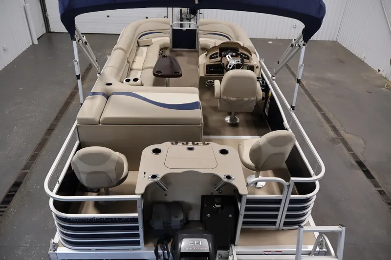 Slide: The Image of 2012 Bennington 2075 GS pontoon boat with beige seating and blue canopy. - 10