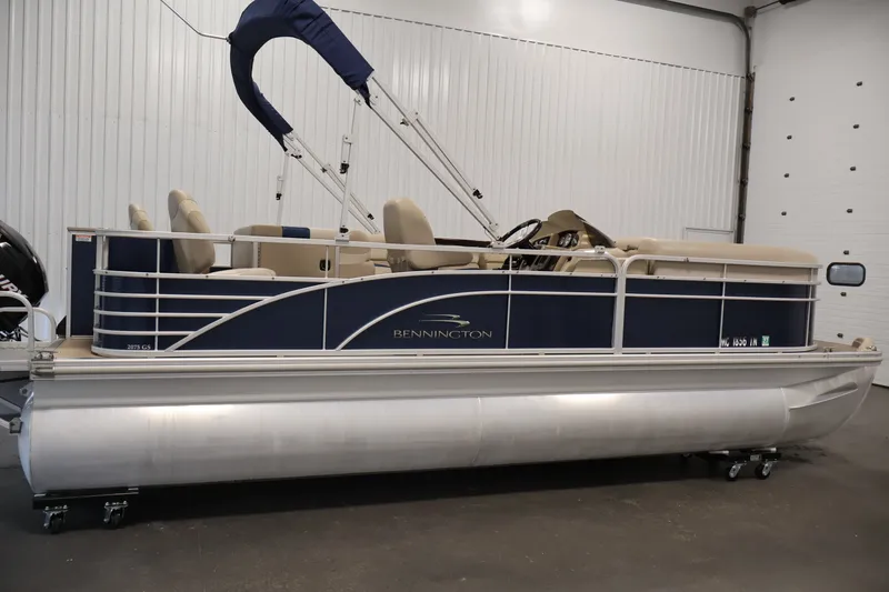 Slide: The Image of 2012 Bennington 2075 GS pontoon boat in indoor storage, side view. - 4