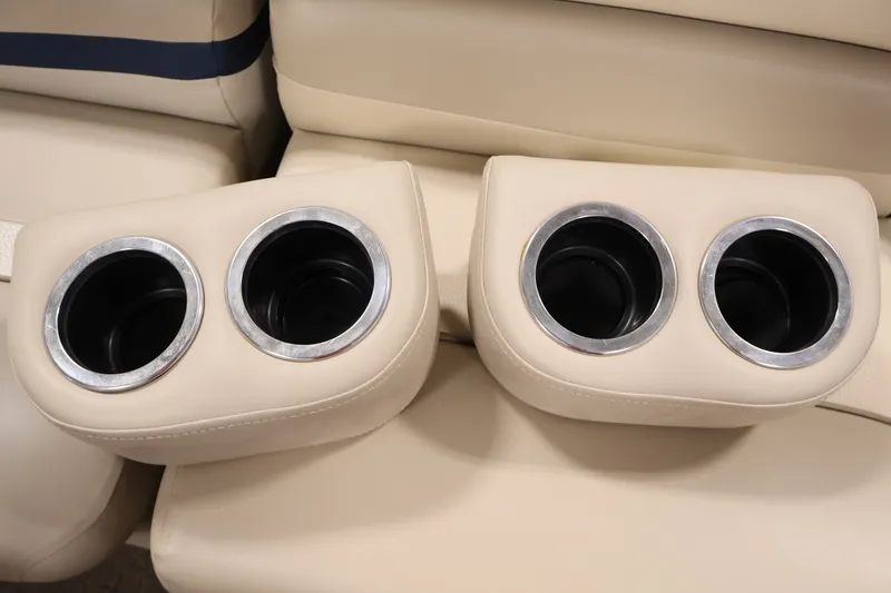 Slide: The Image of Cup holders on beige seating, 2012 Bennington 2075 GS boat interior. - 15