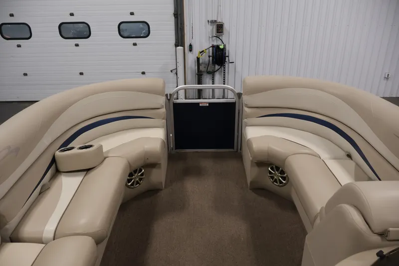 Slide: The Image of Interior of a 2012 Bennington 2075 GS pontoon boat with beige seating. - 11