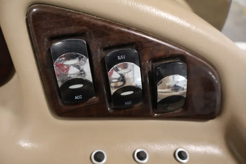 Slide: The Image of Control panel of a 2012 Bennington 2075 GS boat with switches labeled ACC, NAV, ANC. - 28