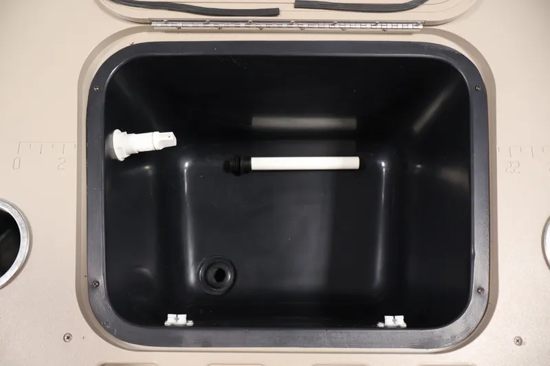 Slide: The Image of Livewell compartment of a 2012 Bennington 2075 GS boat, featuring drainage and fittings. - 42