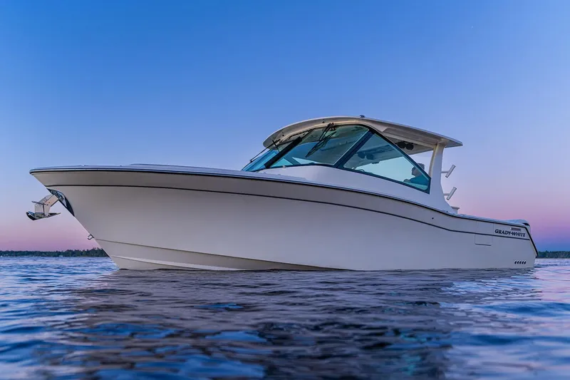 Slide: The Image of Manufacturer Provided Image: Grady-White Freedom 345 boat 2026 on calm water at sunset. - 12