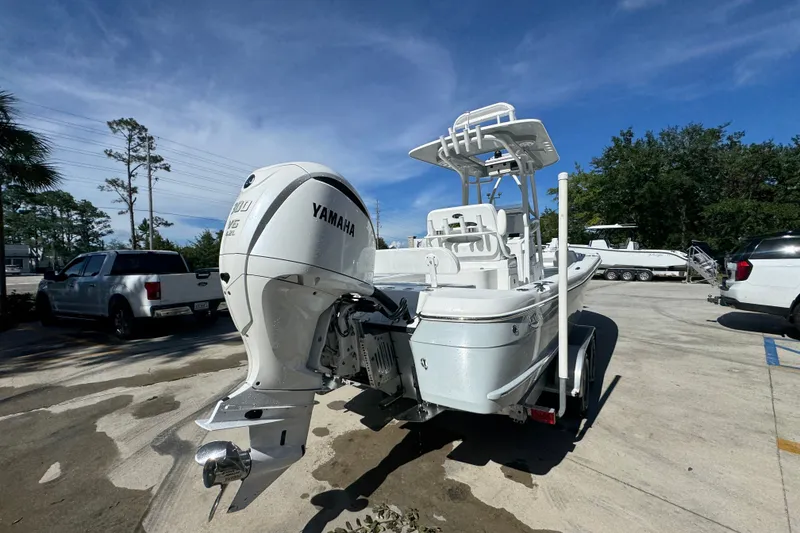 Slide: The Image of 2025 BlackJack 256 Coastal boat with Yamaha engine in a parking lot. - 11