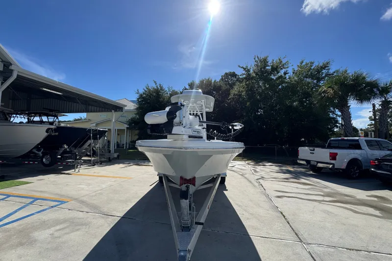 Slide: The Image of 2025 BlackJack 256 Coastal boat on trailer under sunny sky at marina. - 6