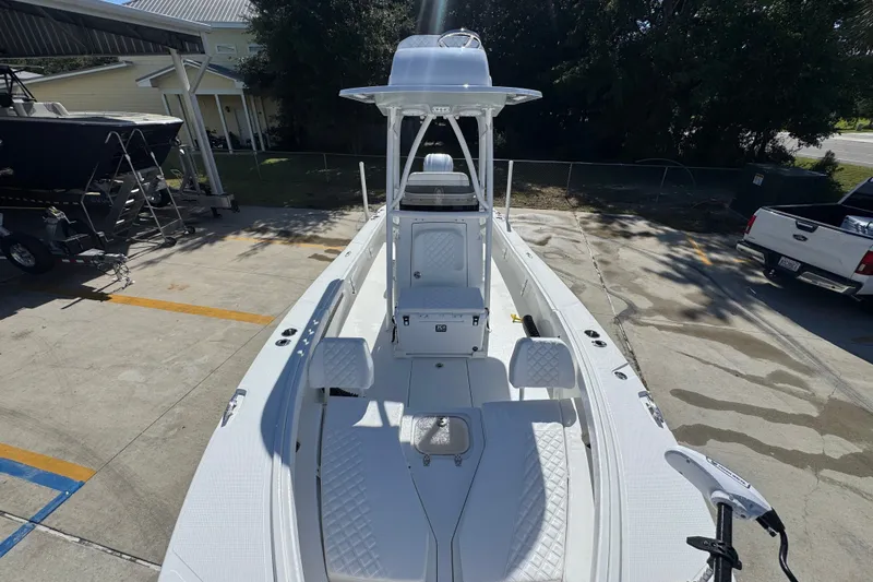Slide: The Image of 2025 BlackJack 256 Coastal boat parked in a sunny outdoor area. - 20
