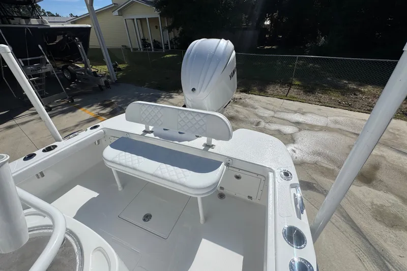 Slide: The Image of 2025 BlackJack 256 Coastal boat with Yamaha engine, featuring a sleek white interior and seating. - 39