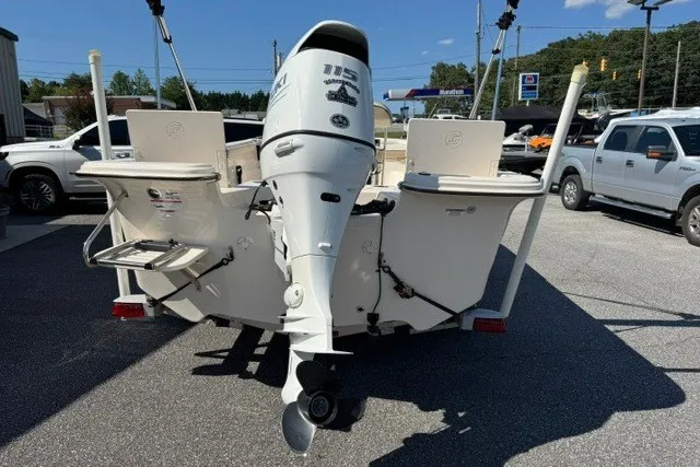 Slide: The Image of 2021 Carolina Skiff 19 LS boat with outboard motor, parked in a lot. - 5