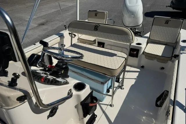 Slide: The Image of 2021 Carolina Skiff 19 LS boat interior with steering wheel and seating. - 10