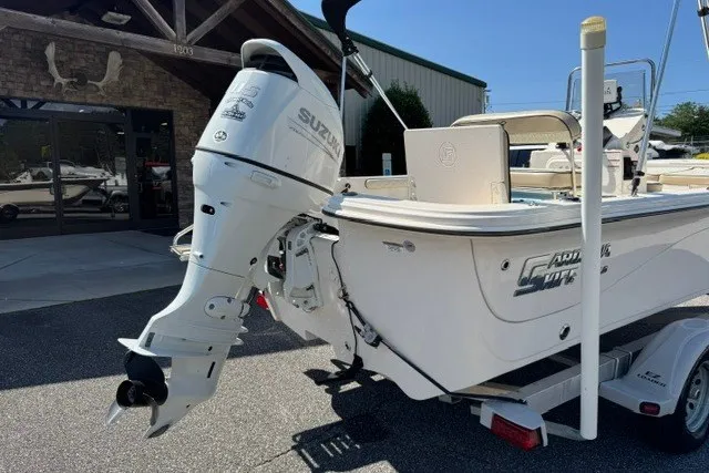 Slide: The Image of 2021 Carolina Skiff 19 LS boat with Suzuki outboard motor on trailer. - 7