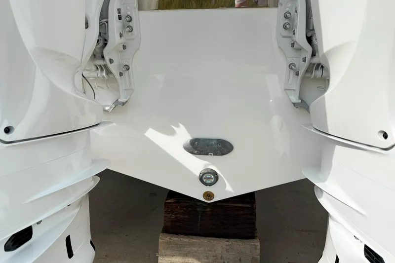 Slide: The Image of 2026 Pursuit S 328 Sport boat transom with dual outboard engines. - 27
