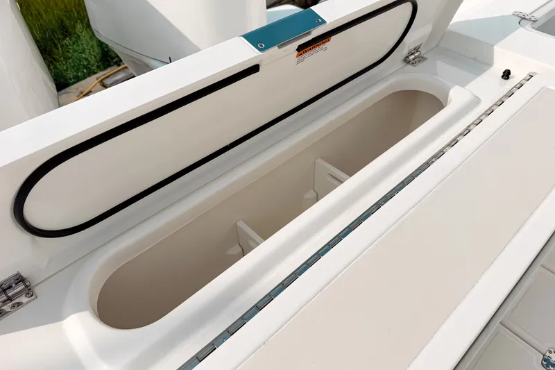 Slide: The Image of Open storage compartment on 2027 Pursuit S 328 Sport boat. - 5