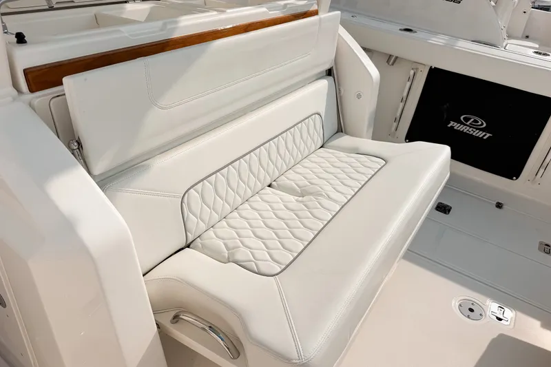 Slide: The Image of Luxurious seating on 2027 Pursuit S 328 Sport boat with quilted upholstery. - 10