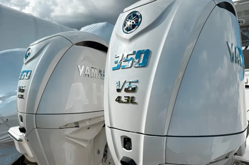 Slide: The Image of Twin Yamaha 350 V6 outboard engines on a 2026 Pursuit S 328 Sport boat. - 1