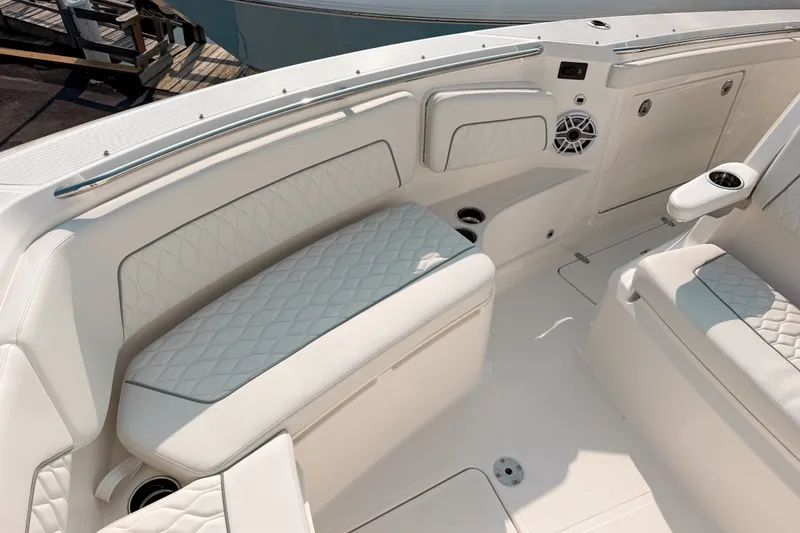 Slide: The Image of Luxurious seating on 2027 Pursuit S 328 Sport boat, featuring white quilted upholstery. - 20