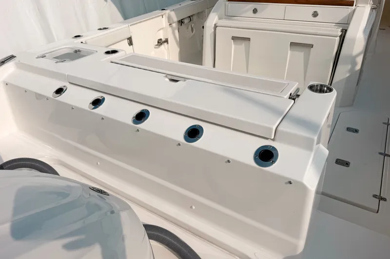 Slide: The Image of 2027 Pursuit S 328 Sport boat interior with sleek white design and modern features. - 4