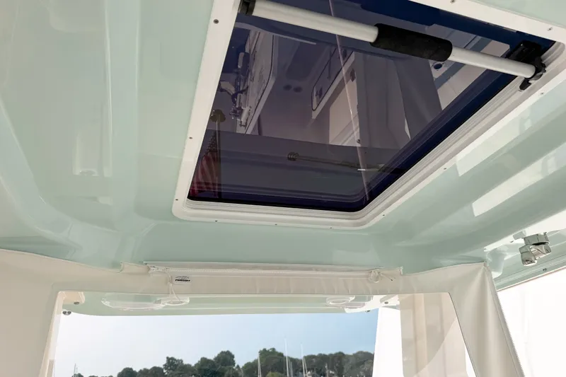 Slide: The Image of 2027 Pursuit S 328 Sport boat interior with skylight and sleek design. - 17