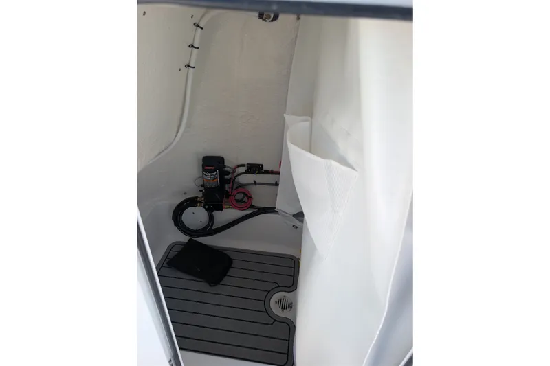 Slide: The Image of Interior of 2027 Tidewater 2500 Carolina Bay boat, featuring storage and equipment area. - 13