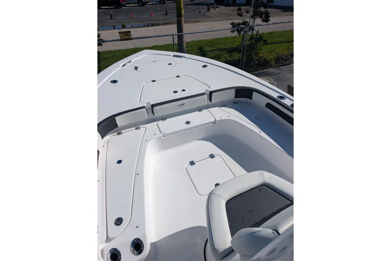 Slide: The Image of 2027 Tidewater 2500 Carolina Bay boat deck with seating and storage compartments. - 10