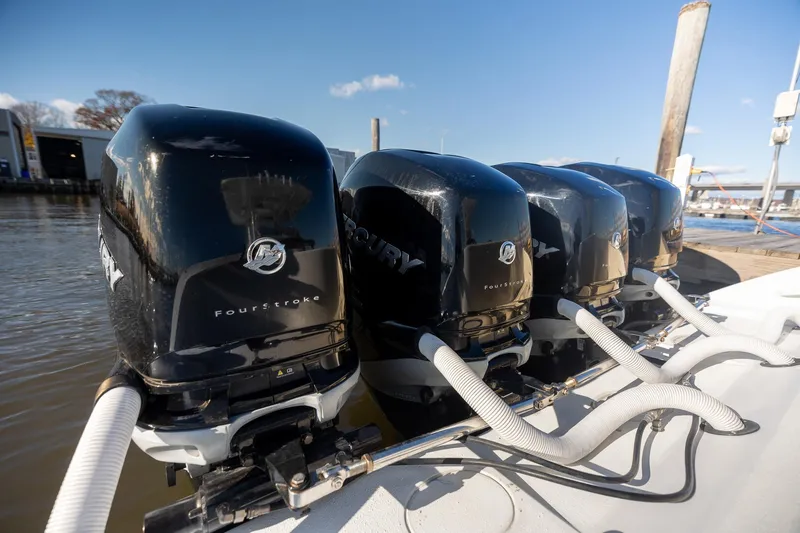 Slide: The Image of Four Mercury outboard engines on a 2018 Yellowfin 39 Offshore boat at a dock. - 13