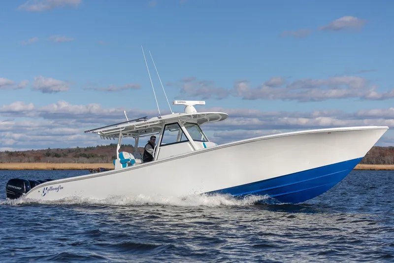 Slide: The Image of 2018 Yellowfin 39 Offshore boat cruising on open water under a clear sky. - 31