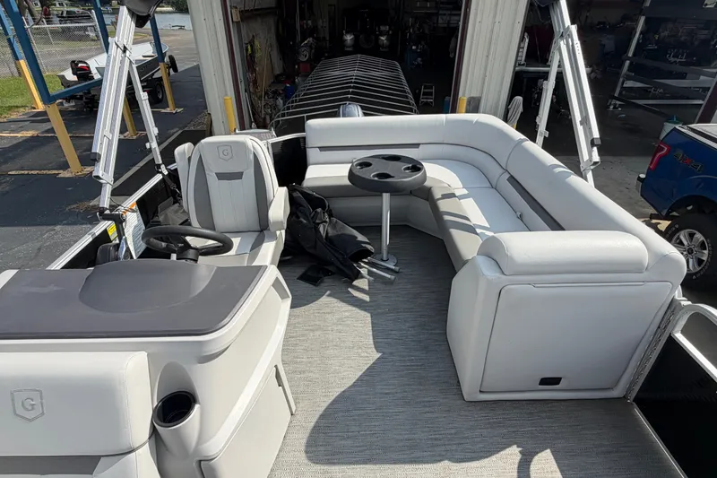 Slide: The Image of 2023 Godfrey Sweetwater 2086 CX pontoon boat interior with seating and helm. - 10