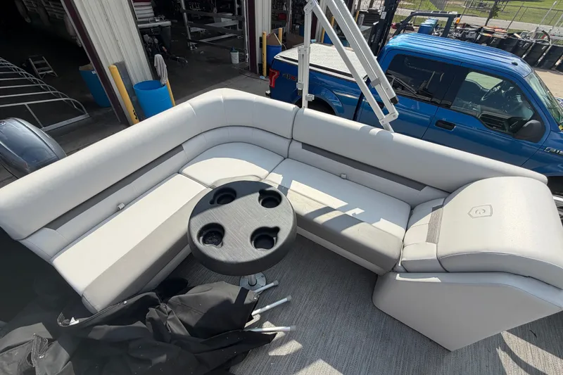 Slide: The Image of 2023 Godfrey Sweetwater 2086 CX pontoon boat interior with seating and cup holders. - 14