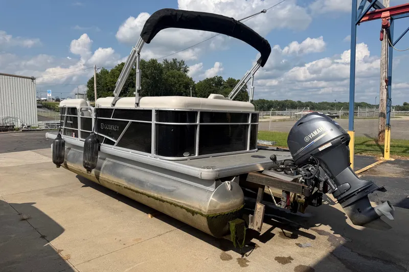 Slide: The Image of 2023 Godfrey Sweetwater 2086 CX pontoon boat with Yamaha outboard motor, docked outdoors. - 5