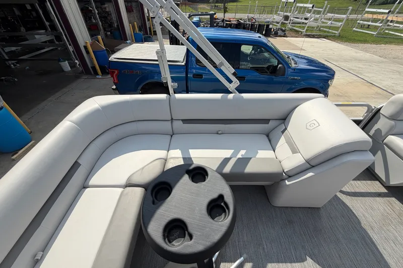 Slide: The Image of 2023 Godfrey Sweetwater 2086 CX pontoon boat interior with seating and cup holders. - 15
