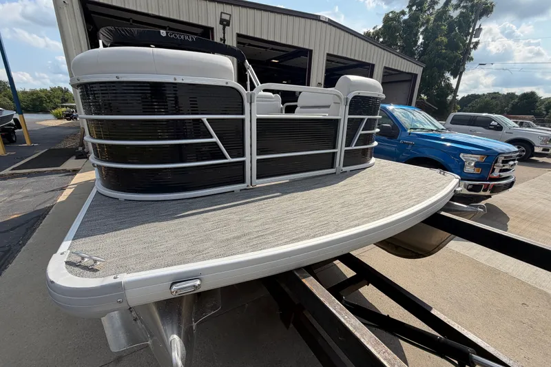 Slide: The Image of 2023 Godfrey Sweetwater 2086 CX pontoon boat on trailer, parked outdoors. - 7