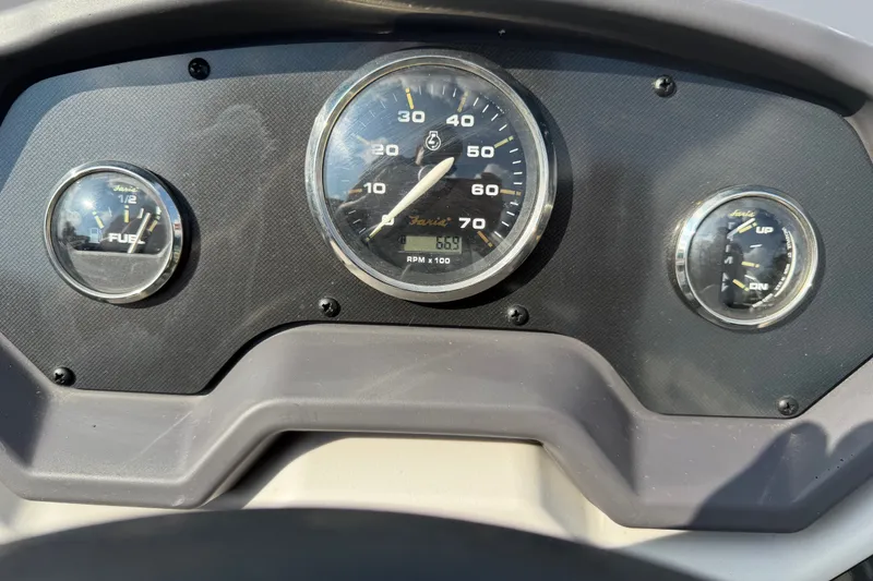 Slide: The Image of Dashboard of 2023 Godfrey Sweetwater 2086 CX boat with gauges for speed, fuel, and trim. - 13
