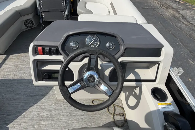 Slide: The Image of Steering console of 2023 Godfrey Sweetwater 2086 CX pontoon boat with gauges and controls. - 12