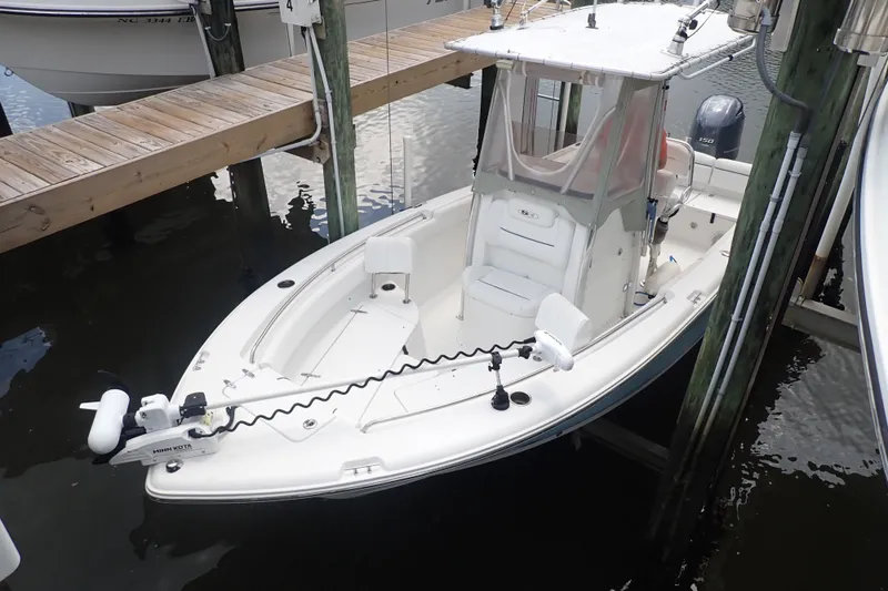 Slide: The Image of 2017 Sea Hunt Ultra 211 boat docked, featuring a sleek design and modern equipment. - 1