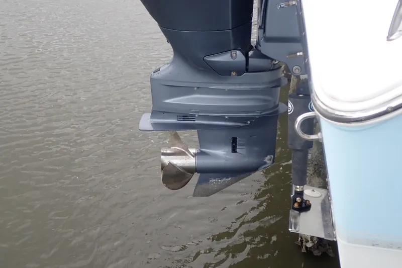 Slide: The Image of Outboard motor of a 2017 Sea Hunt Ultra 211 boat on water. - 46