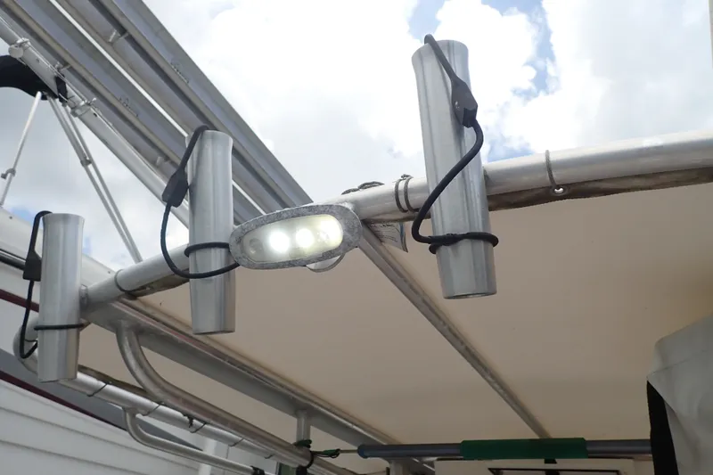 Slide: The Image of LED lights and rod holders on a 2017 Sea Hunt Ultra 211 boat. - 32