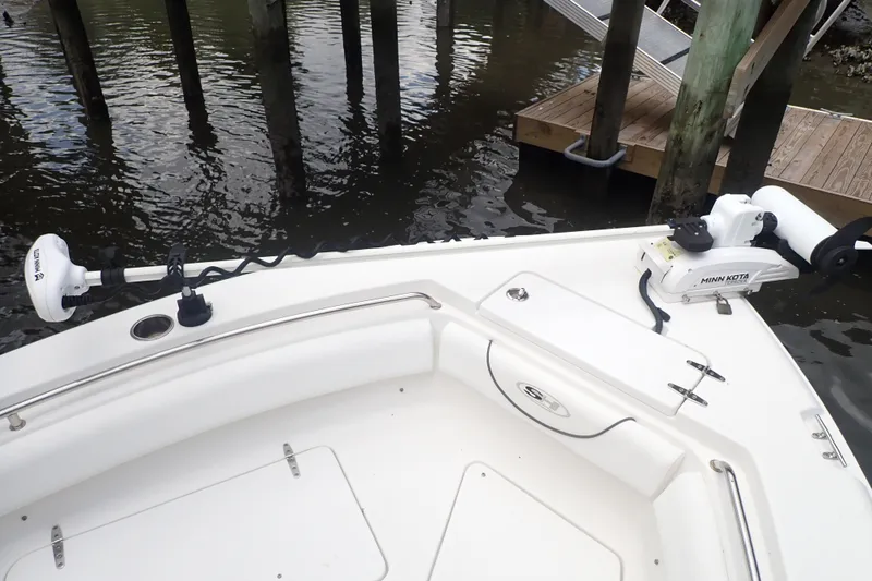 Slide: The Image of 2017 Sea Hunt Ultra 211 boat with Minn Kota trolling motor at dock. - 15