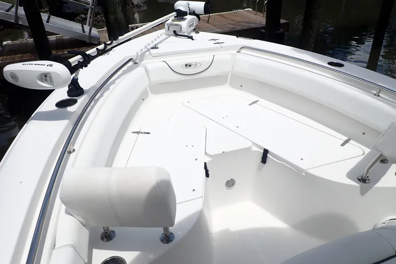 Slide: The Image of 2017 Sea Hunt Ultra 211 boat interior with seating and storage compartments. - 14
