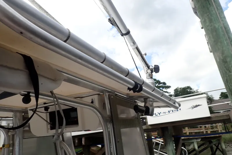 Slide: The Image of 2017 Sea Hunt Ultra 211 boat with mounted fishing rod holders and equipment. - 30