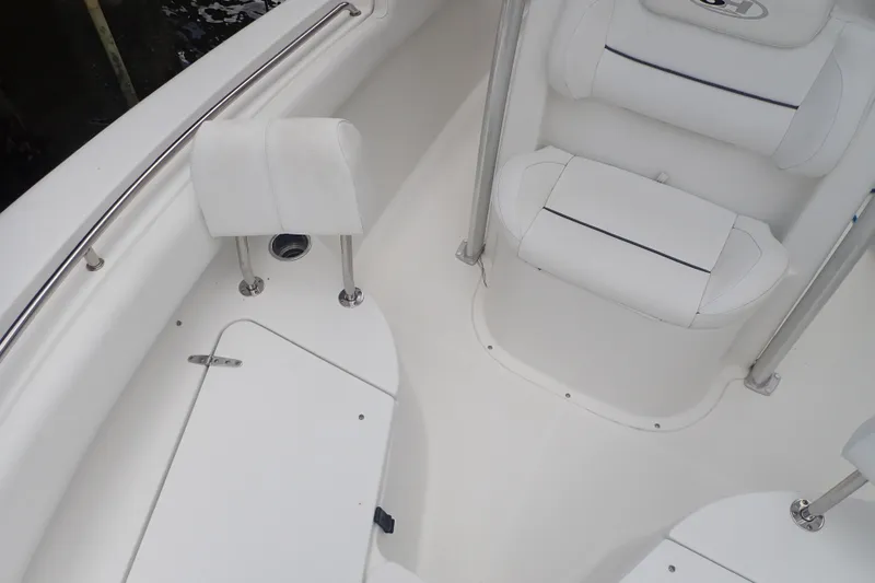 Slide: The Image of 2017 Sea Hunt Ultra 211 boat interior with white seating and stainless steel railings. - 19