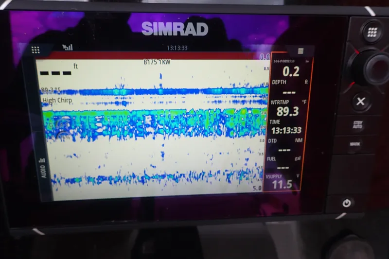 Slide: The Image of Simrad marine display showing sonar data on a 2017 Sea Hunt Ultra 211 boat. - 23
