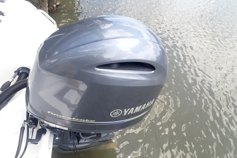 Slide: The Image of Yamaha outboard motor on 2017 Sea Hunt Ultra 211 boat, docked on water. - 45
