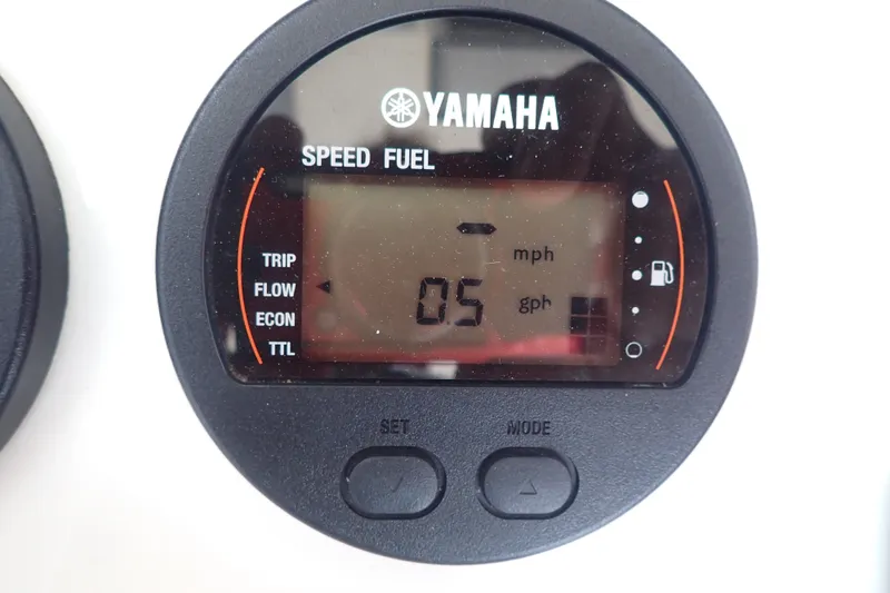 Slide: The Image of Yamaha speed and fuel gauge on 2017 Sea Hunt Ultra 211 boat dashboard. - 27
