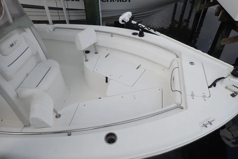Slide: The Image of 2017 Sea Hunt Ultra 211 boat interior with seating and storage compartments. - 9