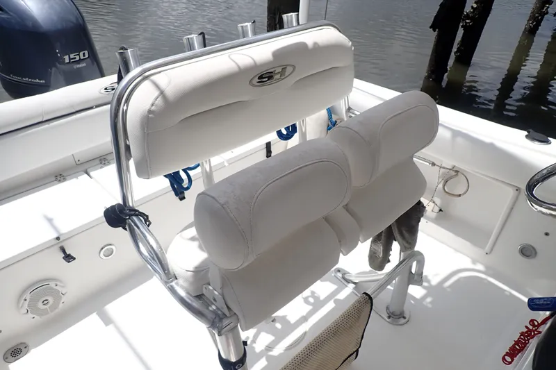 Slide: The Image of 2017 Sea Hunt Ultra 211 boat interior with dual seats and Yamaha 150 outboard motor. - 11