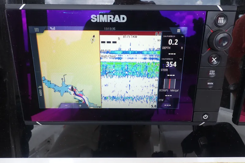 Slide: The Image of Simrad marine display on 2017 Sea Hunt Ultra 211, showing navigation and sonar data. - 22